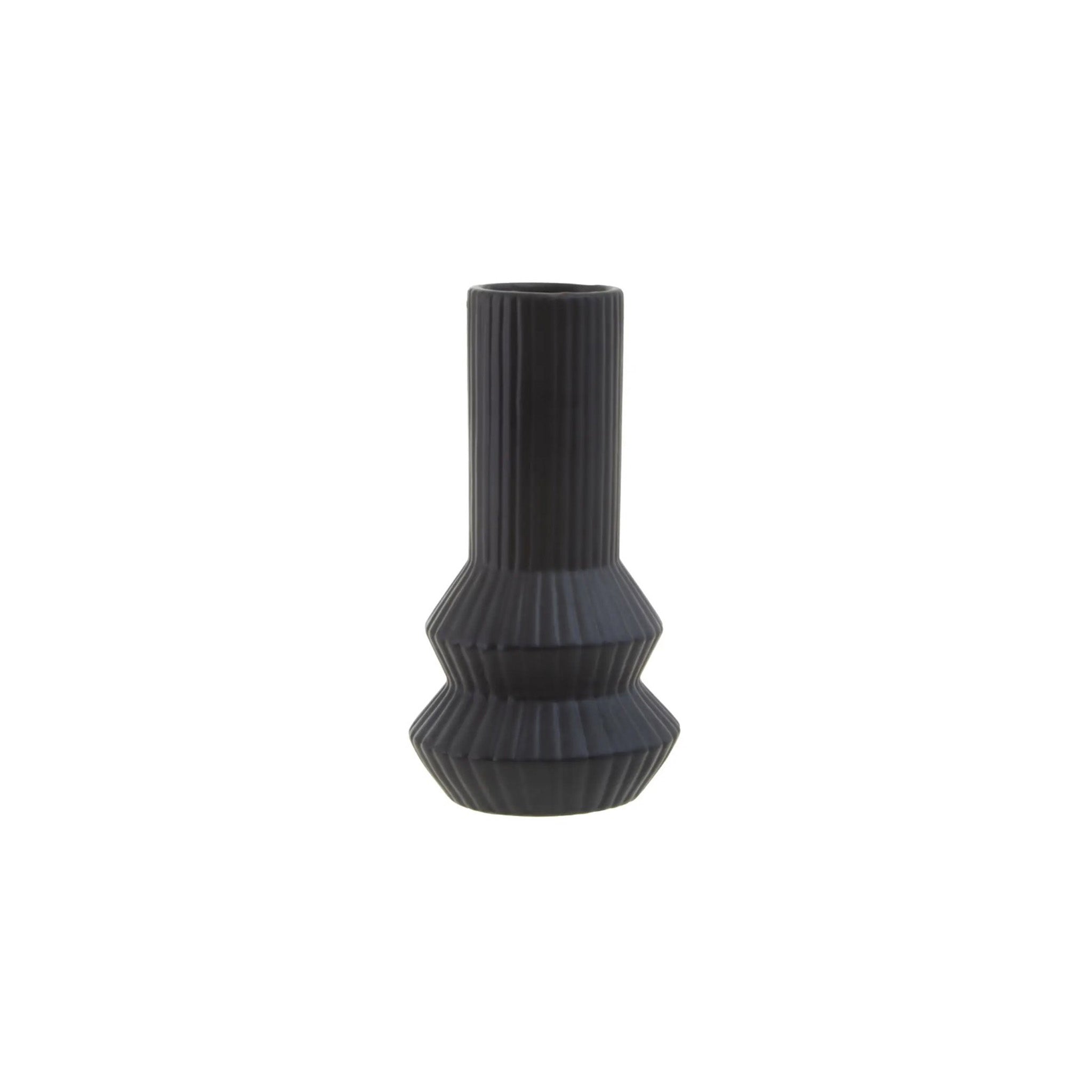 Geometric matte black vase with a soft ribbed surface. A minimalistic angular design, to the base, made from fine stoneware which does not chip or wear. Dimensions: H22 x D12 x W12 Materials: Dolomite Delivery: 7-10 working days